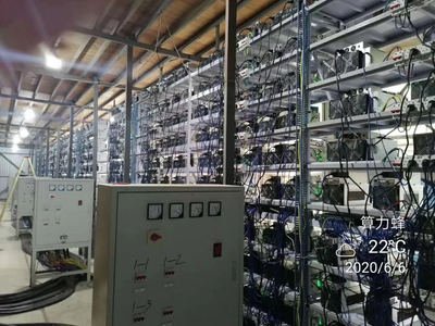 Expansive cryptocurrency mining farm with rows of cooling fans and mining rigs