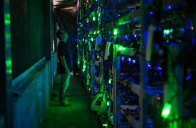 A large-scale mining farm with rows of mining rigs, highlighting the efficiency and scale of cloud mining operations.